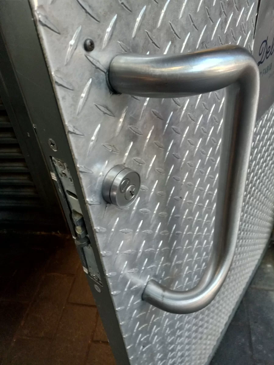 Apartment Building Security Tips: Enhancing Safety with Caliber Locksmith in Maryland Metal Door Lock Repair Jpg