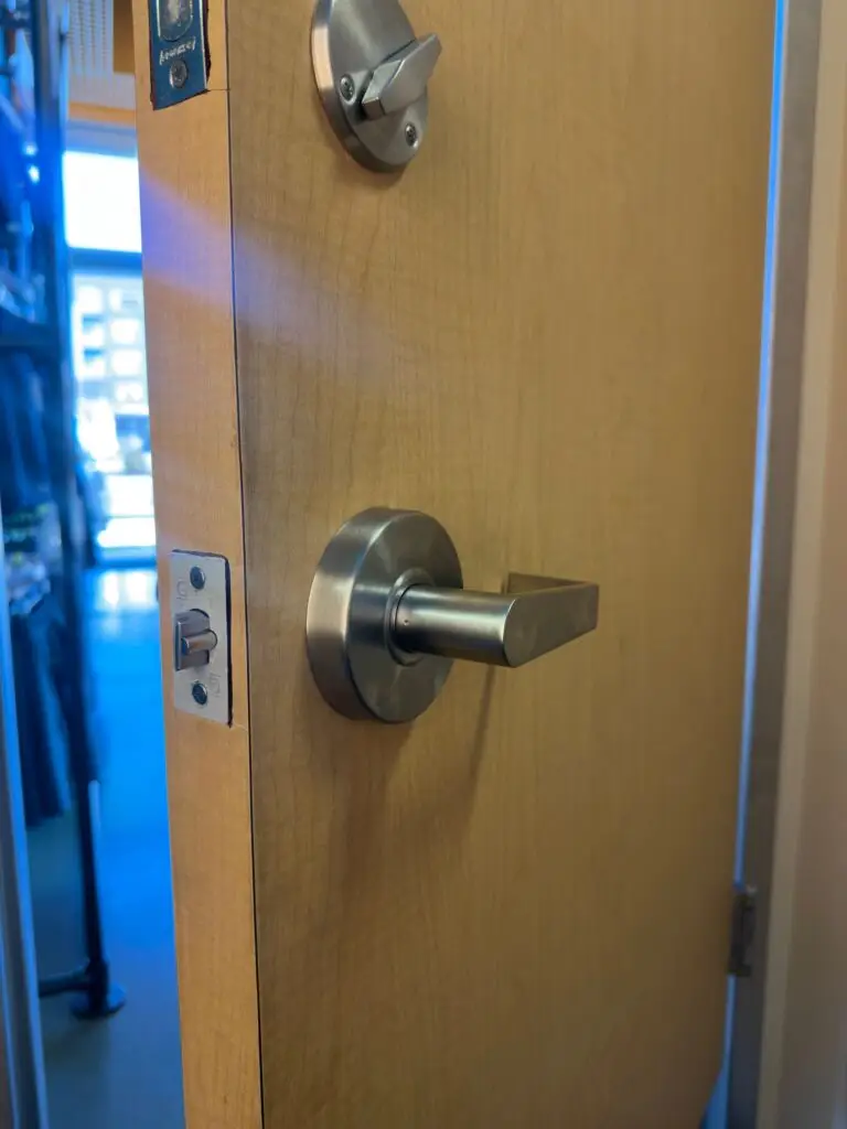 installed lever commercial handle and new commercial deaedbolt