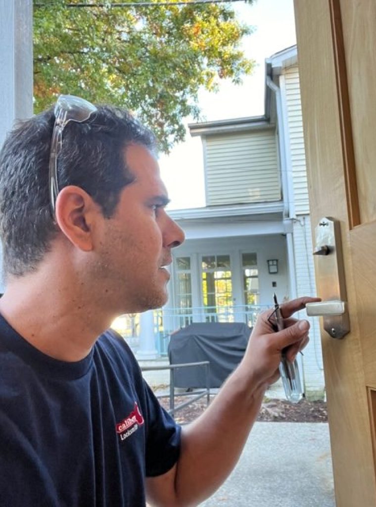 Tamir Testing Repaired Decorative Door Handle Tamir checking handle of new residential door lock installed